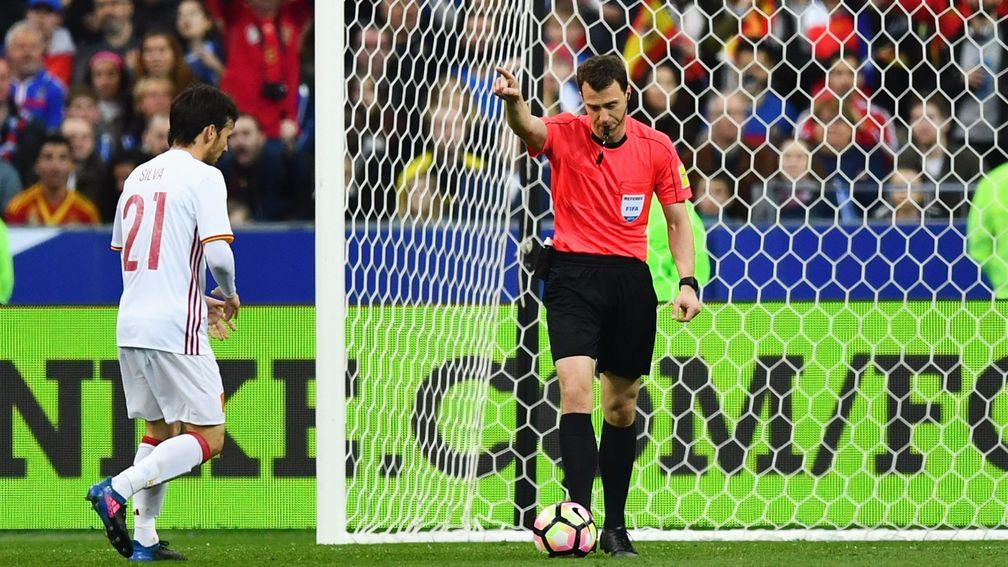 Referee Felix Zwayer awards Spain's second goal against France after a review