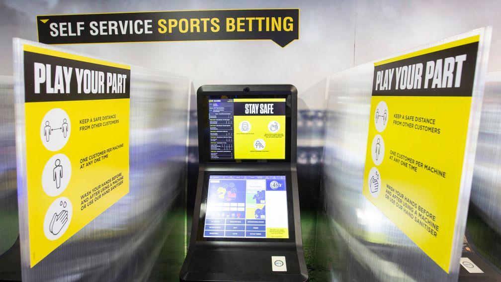 Betting terminals at Coral shops are divided by plastic screens