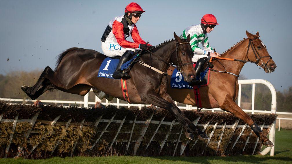 Zanahiyr (right) jumps with Saint Sam on his way to victory in the Grade 3 juvenile hurdle at Fairyhouse