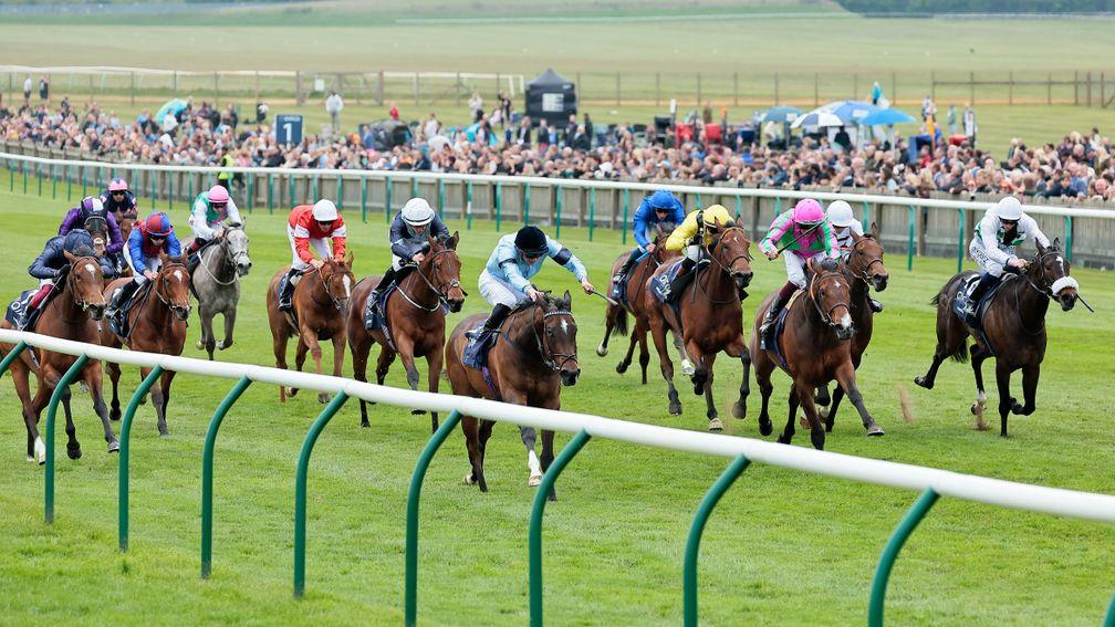Zellie and Tom Marquand (second from right, white cap) charge home late to finish fourth in the 1,000 Guineas