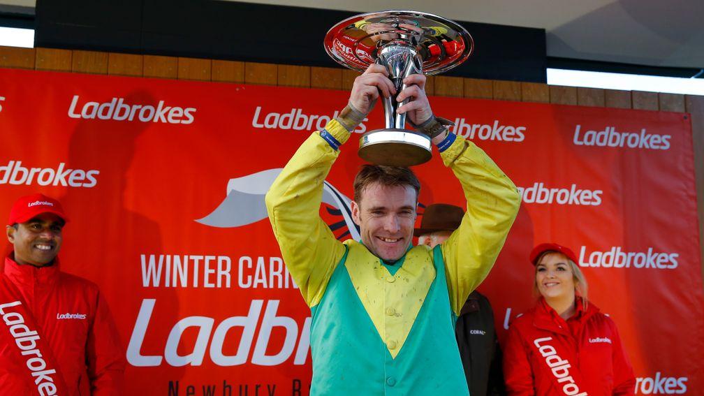 Tom Scudamore celebrates after winning the Ladbrokes Trophy