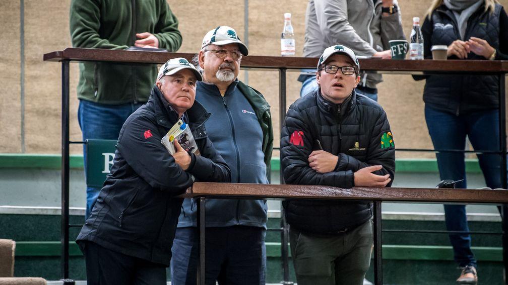 Vimal Khosla (centre) looks on with John O'Connor (left) and Mark Byrne (right) of Ballylinch Stud as the Galileo filly out of Green Room makes her way around the Goffs ring
