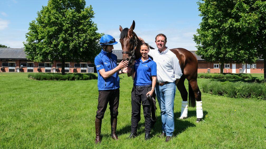 Godolphin trainer Charlie Appleby poses with Derby winner Adayar at Moulton Paddocks