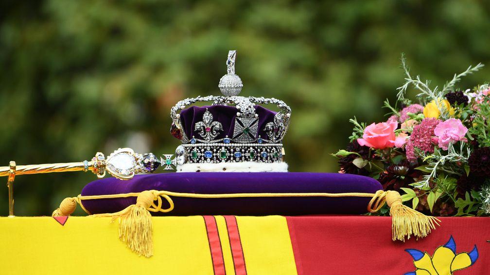 The Imperial State Crown atop the Queen's coffin is borne through the streets of London during her state funeral on Monday