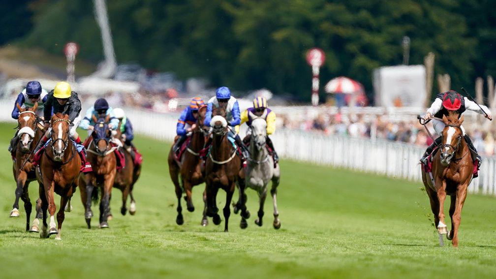 CHICHESTER, ENGLAND - JULY 26: Ryan Moore riding Kyprios (R, red cap) win The Al Shaqab Goodwood Cup Stakes from Andrea Atzeni riding Stradivarius (L, yellow cap) during day one of the Qatar Goodwood Festival at Goodwood Racecourse on July 26, 2022 in Chi