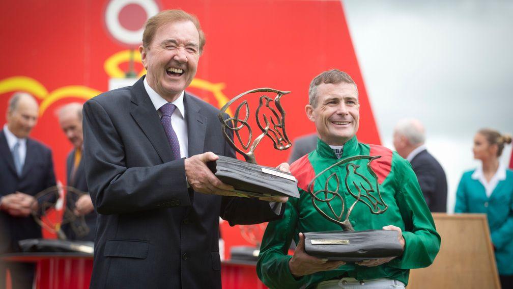 Pat Smullen (right) and Dermot Weld with their trophies after winning the 2016 Irish Derby with Harzand