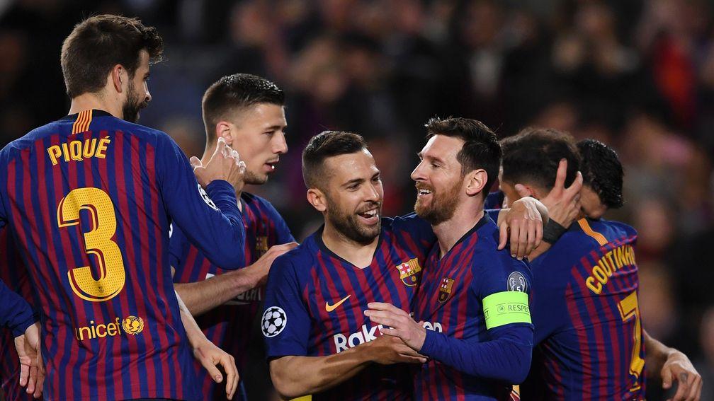 Lionel messi and Barcelona celebrate the first of their five goals at home to Lyon in the last round