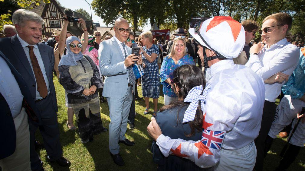 Amer Abdulaziz takes a photo of his daughter with Frankie Dettori at Deauville in 2018