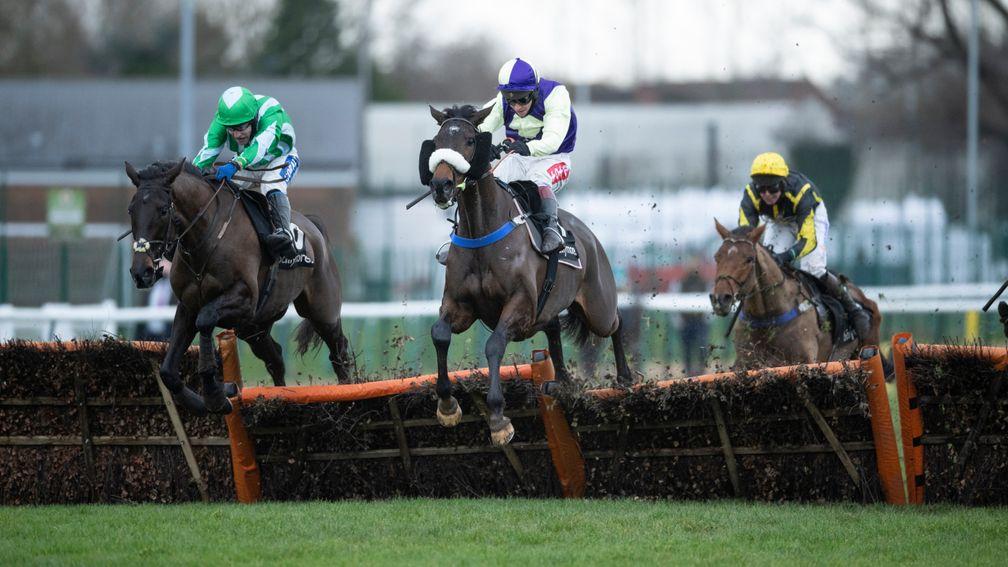 Adrimel (centre): shouldered a 3lb penalty to win the Leamington Novices' Hurdle