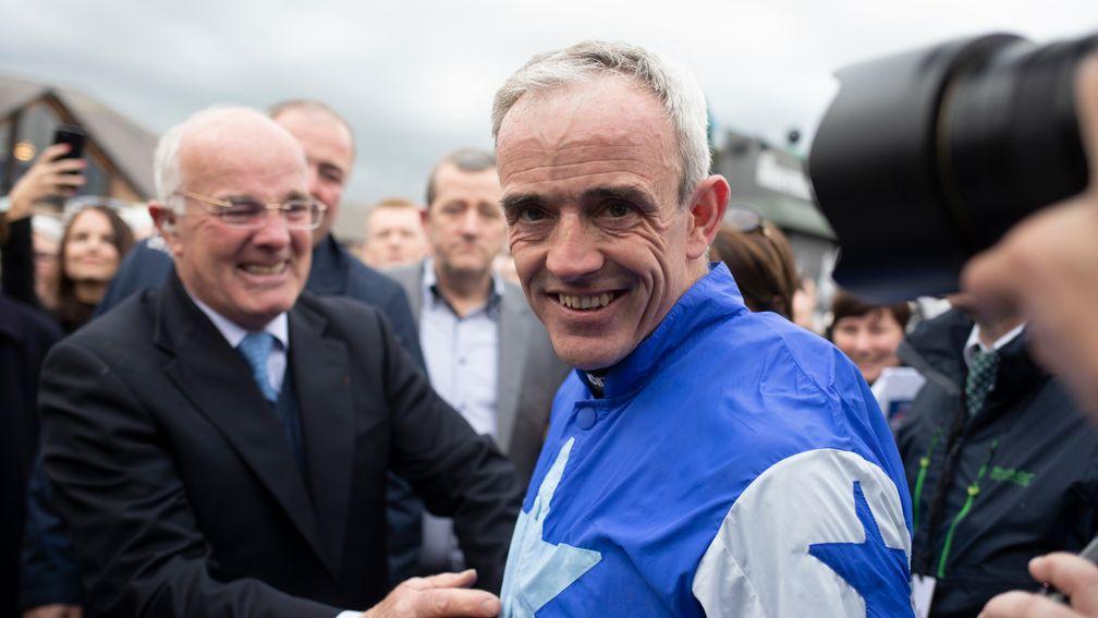 Ted Walsh approaches his son Ruby after the top jockey's Punchestown retirement in 2019