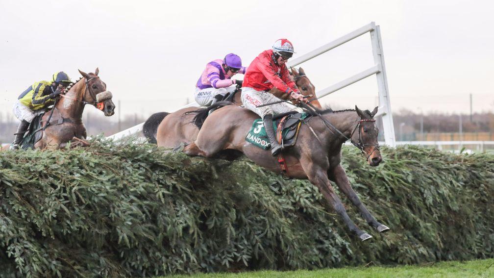 Blaklion and Gavin Sheehan soar over the Aintree spruce en route to victory in the Becher Chase