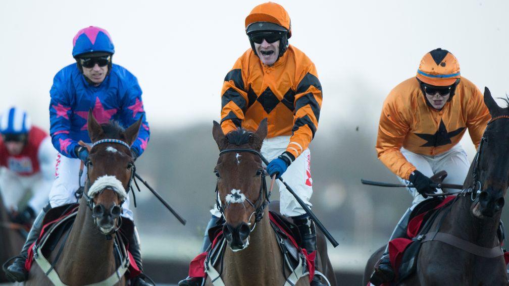 Thistlecrack (Tom Scudamore, centre) and Cue Card (Paddy Brennan, left) pull up after finishing first and second in the King George