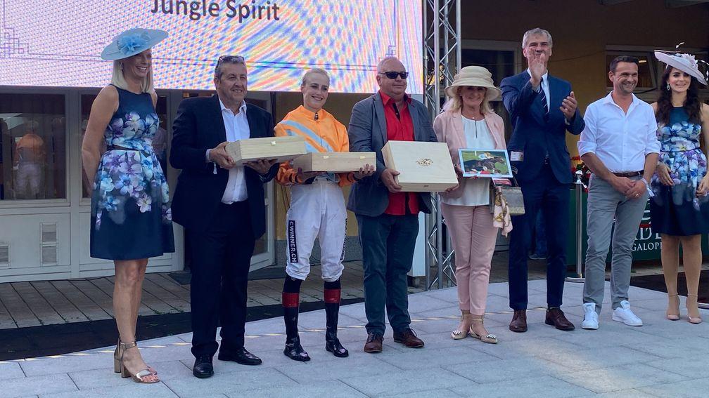Sibylle Vogt receives her prize with winning connections at Baden-Baden