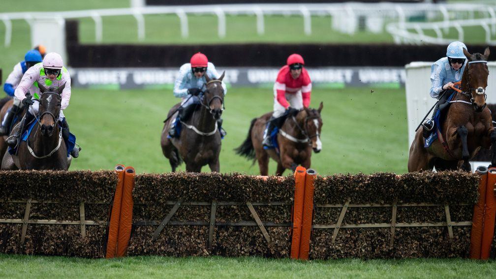 Honeysuckle and Rachael Blackmore (right) clear the last ahead of Benie Des Dieux (left)