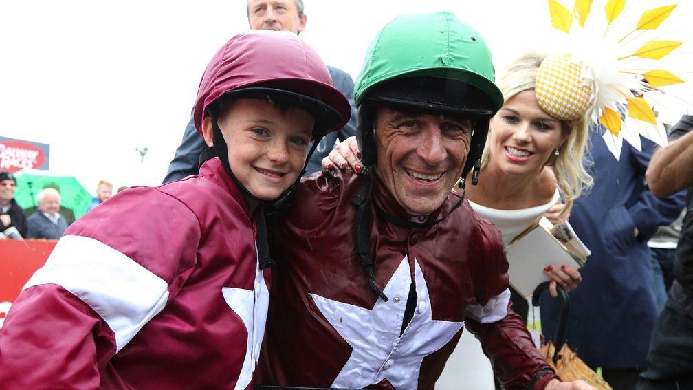 Galway: Davy Russell, who won the Galway Plate on Balko Des Flos, meets young fan Alan Jordan after his victory