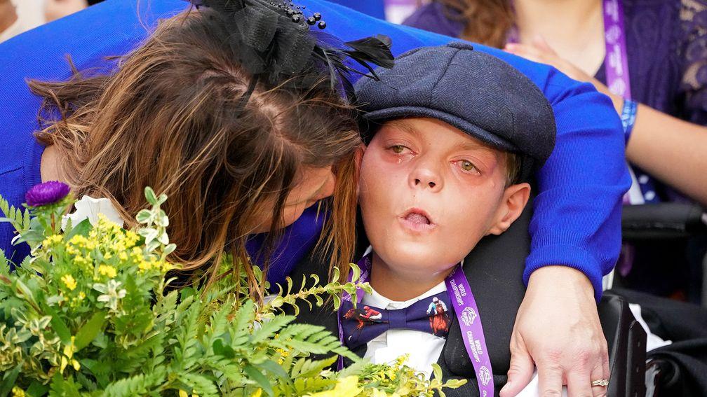 Leslie Dorman comforts her son Cody in the winner's circle after Cody's Wish won the Breeders' Cup Dirt Mile in 2022