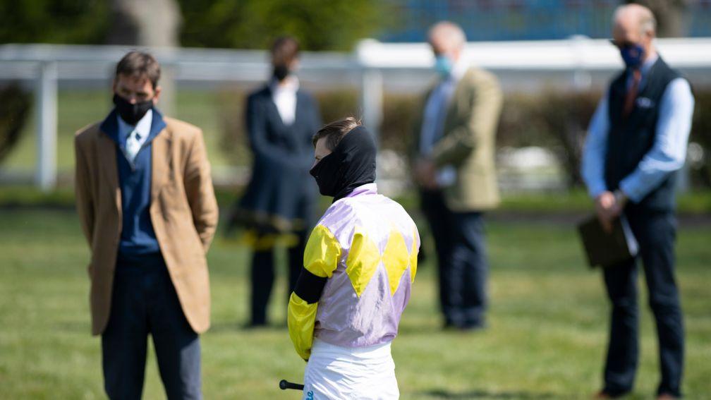 Race connections in the opening race observe a 1 minute silence in memory of amateur jockey Lorna Brooke whose death was announced on Monday morningWindsor 19.4.21 Pic: Edward Whitaker/ Racing Post