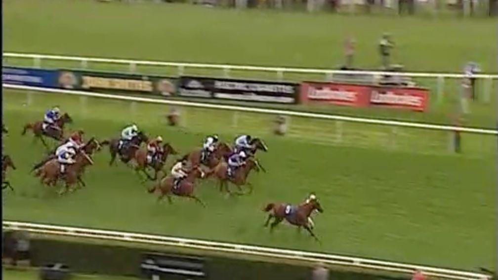 With his saddle slipping, George Baker is thrown out the side door just yards from the line