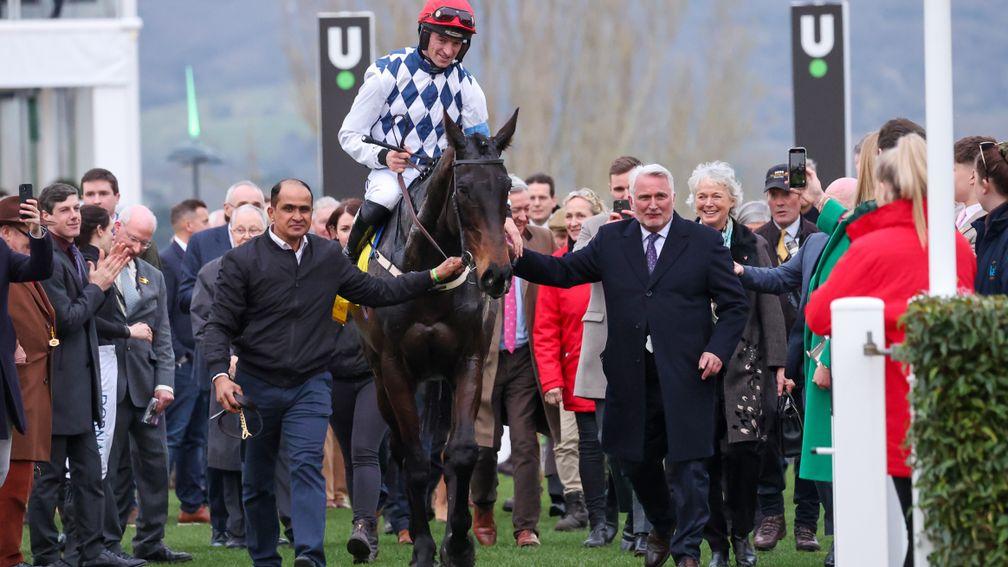 Owner Ronnie Bartlett (right) leads Stattler into the Cheltenham winner's enclosure after his victory in the 2022 National Hunt Chase