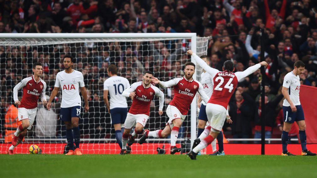 Shkodran Mustafi and Arsenal celebrate their first goal in the north London derby win