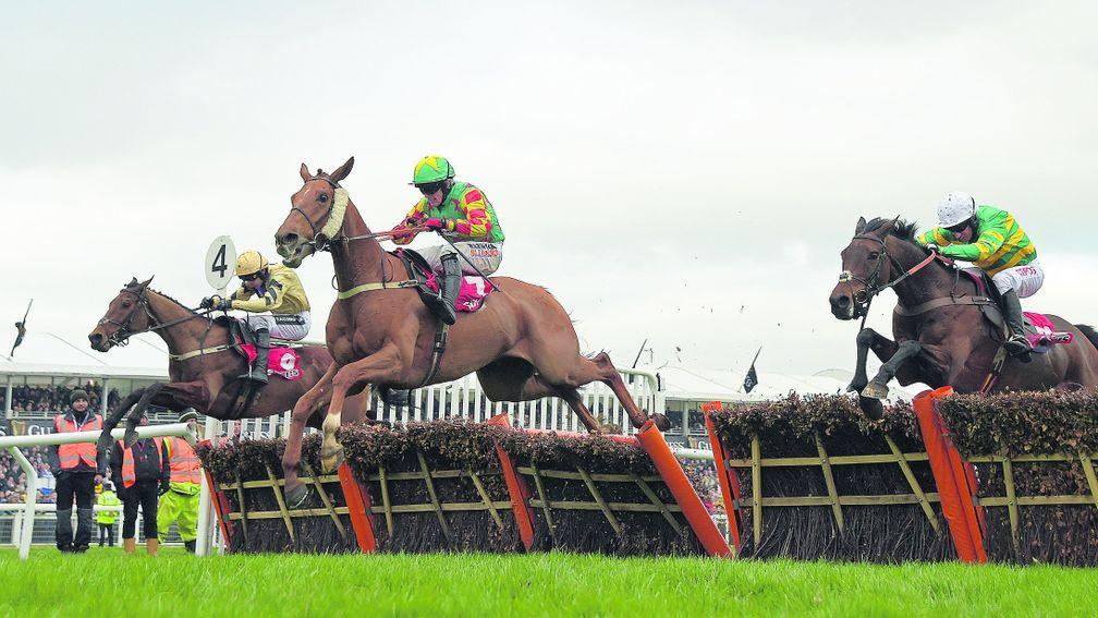 Nichols Canyon (left) crosses the final flight in the Stayers' Hurdle before seeing off Lil Rockerfeller (centre) and Unowhatimeanharry (right)