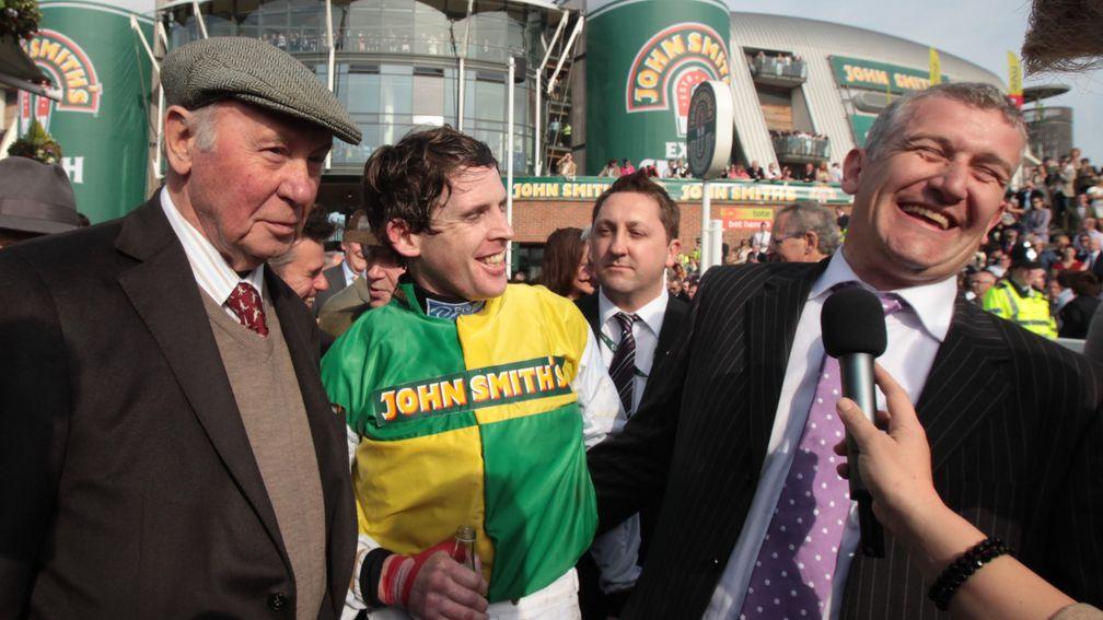 Trevor Hemmings (left) looks on as jockey Jason Maguire and trainer Donald McCain celebrate the 2011 Grand National win of Ballabriggs