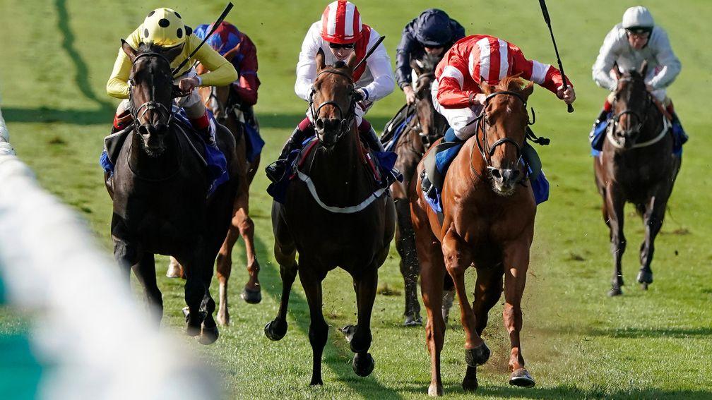 Daahyeh (red, right) wins the Rockfel Stakes at Newmarket