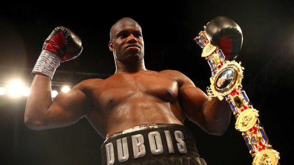 Daniel Dubois celebrates victory over Nathan Gorman by holding the British heavyweight title belt