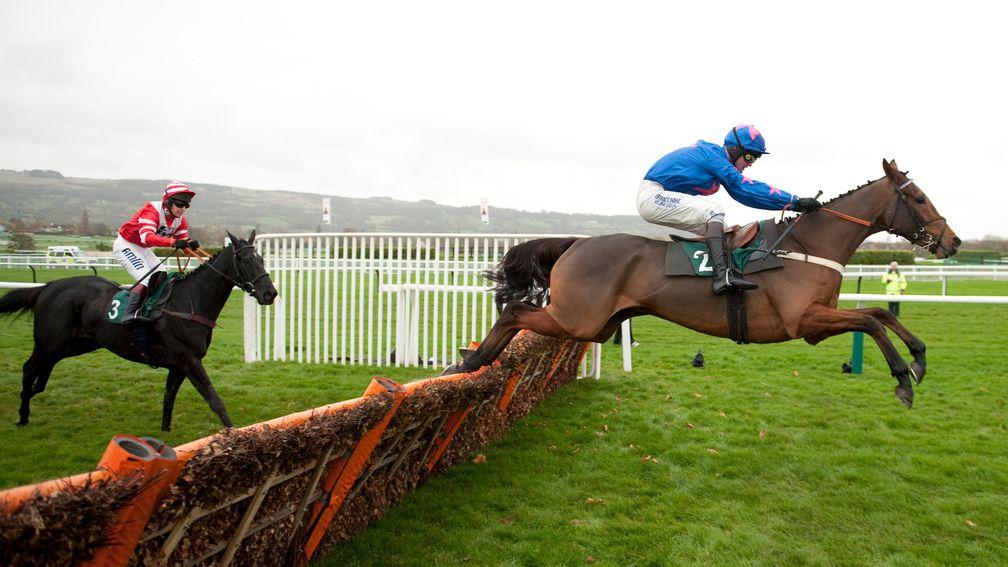 Cue Card and Joe Tizzard jump the final flight on their way to winning at Cheltenham
