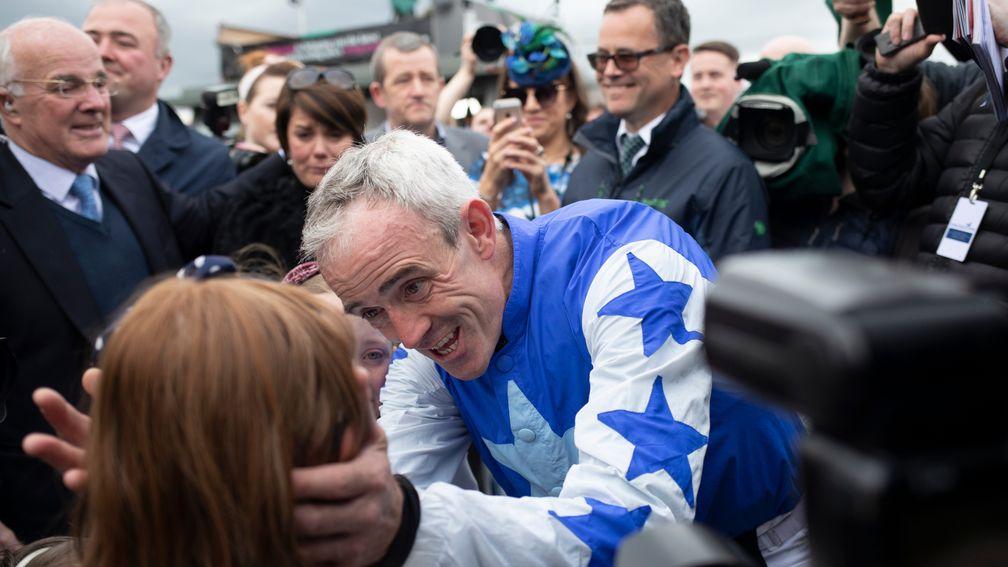 Ruby Walsh shares a moment with his children during an emotional day at Punchestown