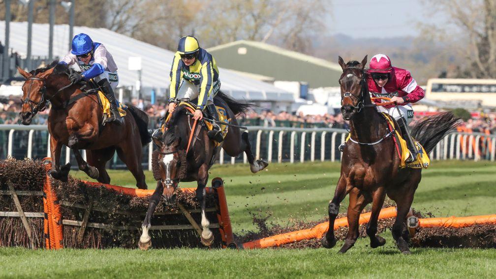 If The Cap Fits (centre) makes a bad mistake at the last but rallies to beat Roksana (left) and Apple's Jade in the Ryanair Stayers Hurdle at Aintree