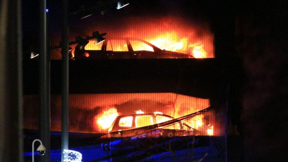 Vehicles burn during a blaze at a multi-storey car park at the Echo Arena on Liverpool's waterfront.