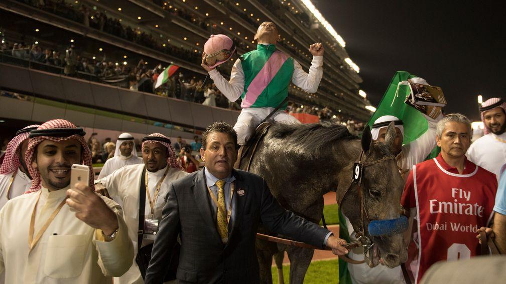 Sheer delight: Mike Smith enjoys the moment after Arrogate's incredible success