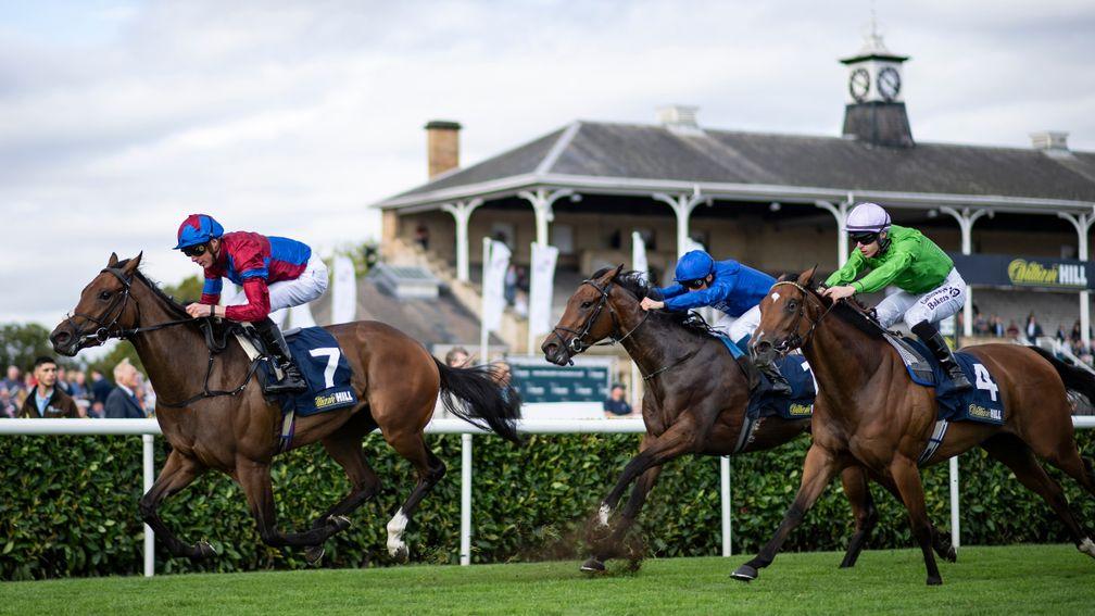Alpen Rose (centre) chases home Powerful Breeze in the May Hill Stakes at Doncaster