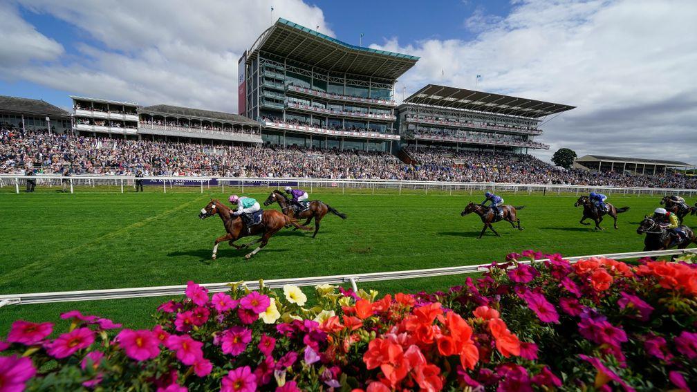 YORK, ENGLAND - AUGUST 17: Ryan Moore riding Chaldean (pink cap) win The Tattersalls Acomb Stakes at York Racecourse on August 17, 2022 in York, England. (Photo by Alan Crowhurst/Getty Images)