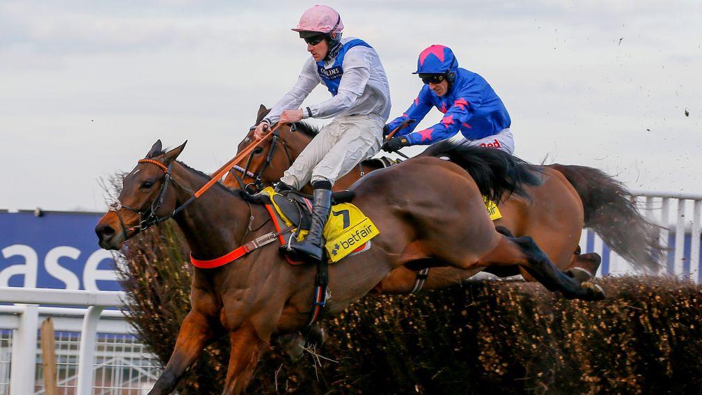 Waiting Patiently (Brian Hughes) takes the last fence ahead of Cue Card in last month's Betfair Ascot Chase