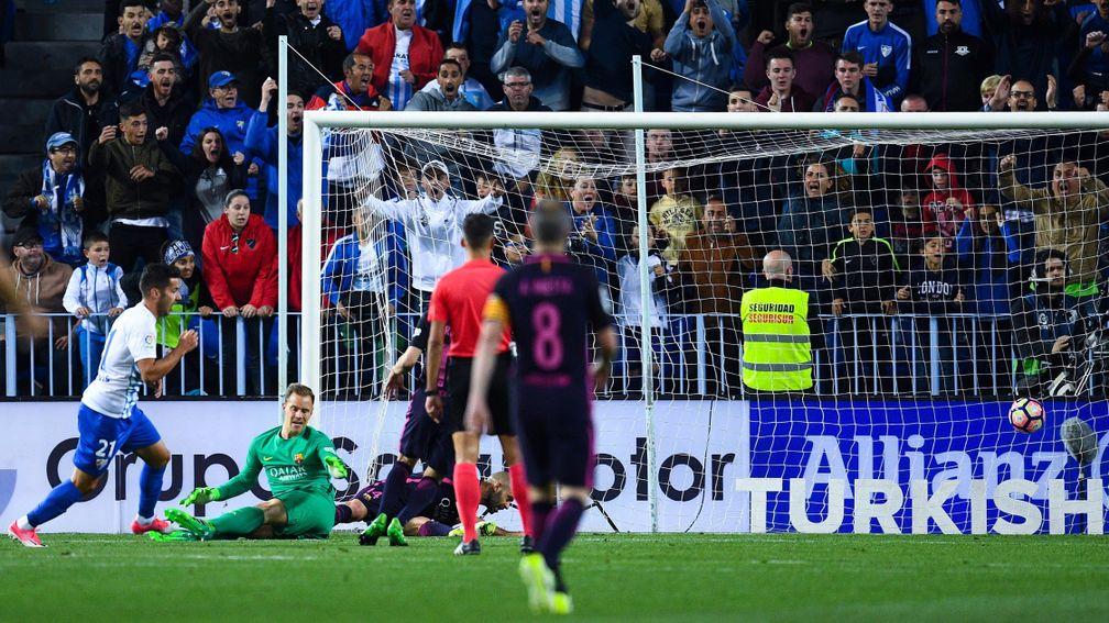 Jony Rodriguez scores Malaga's second goal against Barcelona