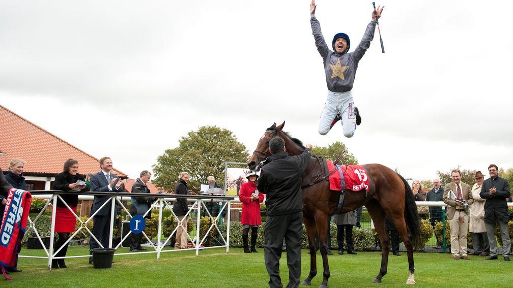 Never Can Tell: Dettori celebrates after winning the Cesarewitch