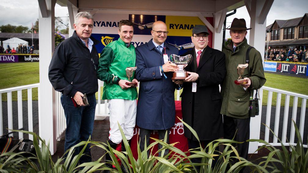 Simon Munir and Isaac Souede (third and second right) after Footpad's success in the Ryanair Novice Chase