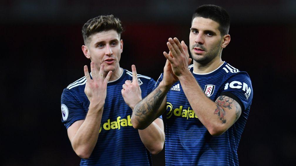 Tom Cairney (left) and Aleksandar Mitrovic (right) will be hoping they can guide Fulham to safety