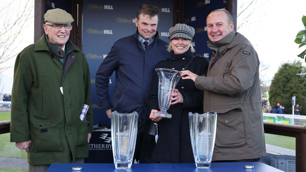 Billy, Michael and Wendy Hamilton receive the prize for the William Hill Rowland Meyrick Handicap Chase at Wetherby