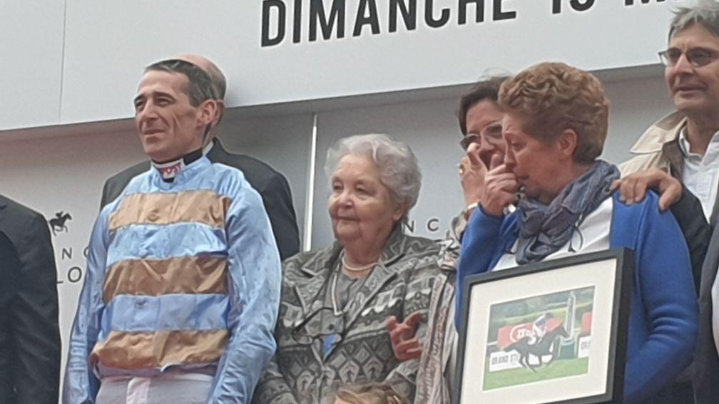 Moved to tears: Isabel Pacault (right) and Davy Russell during the Grand Steeple-Chase de Paris presentation which followed Carriacou's win at Auteuil