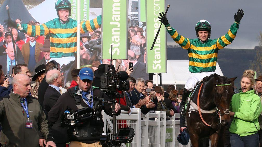 Double delight: Noel Fehily and his on-screen image celebrate Buveur D'Air's Champion Hurdle success in 2017