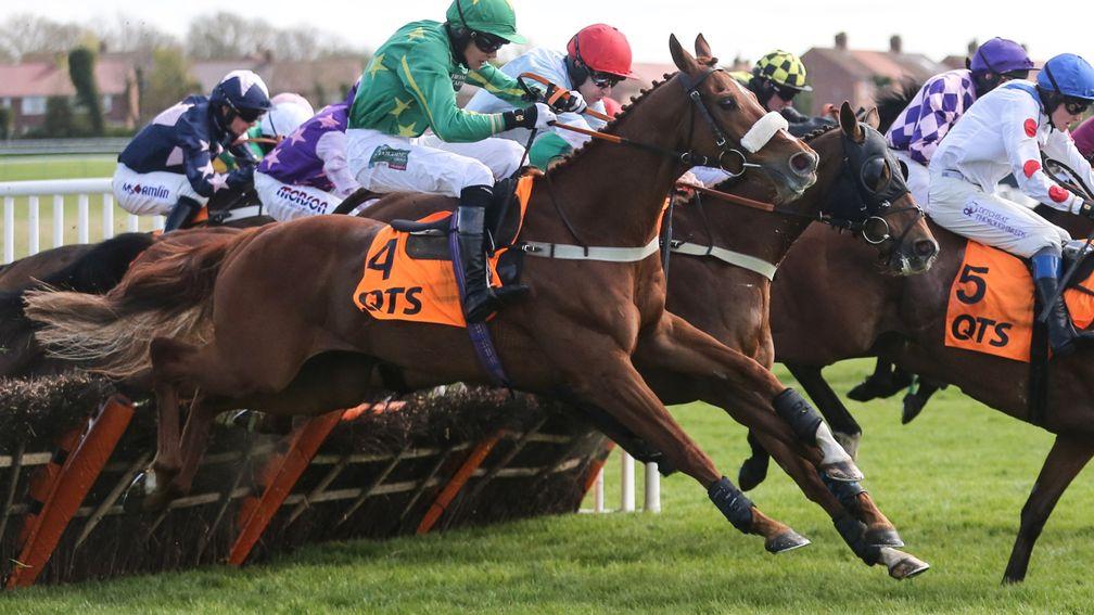 Chesterfield and Daniel Sansom (near side) coming to win the QTS Scottish Champion Hurdle last year
