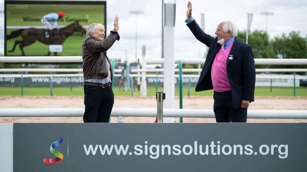 Neil Biggs (left): one of the syndicate of Foxtrot racing receives a socially distanced hands five from ARC chairman David Thorpe at Southwell on Wednesday
