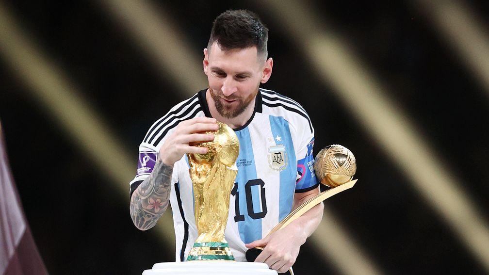 Lionel Messi gets his hands on the World Cup after a dramatic final