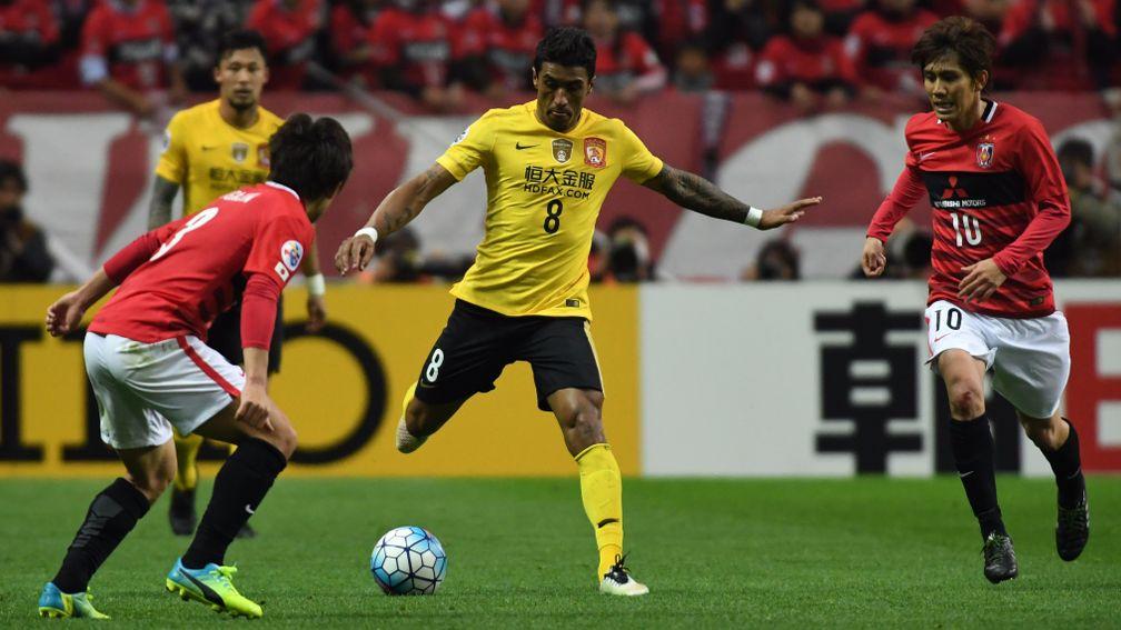Paulinho (centre) has starred for Guangzhou Evergrande this season