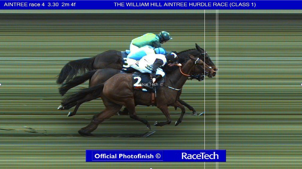 A three-way photo-finish prompted a lengthy stewards' inquiry in the Aintree Hurdle