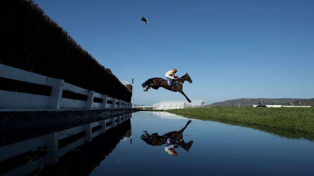 Might Bite and Nico de Boinville soar across the water jump on their way to victory in the RSA Chase