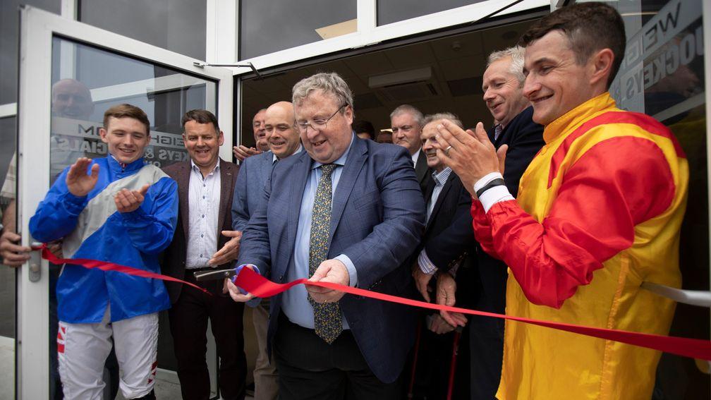 Brian Kavanagh flanked by jockeys Shane Foley and Colin Keane officially opens the new weighing room facility at Roscommon last year